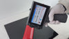 T10 handheld inkjet printer demonstration on a curved plastic surface