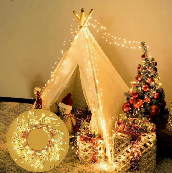 Warm white firecracker cluster lights in a seasonal decorative setting