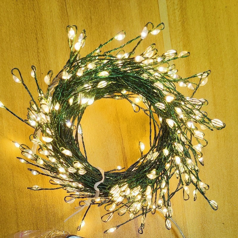 Warm white firecracker cluster lights with green wire